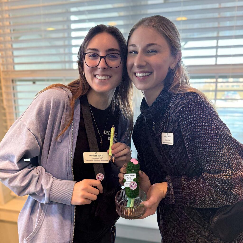 Two team members at Pinnacle Groves Senior Living smile for Employee Appreciation.